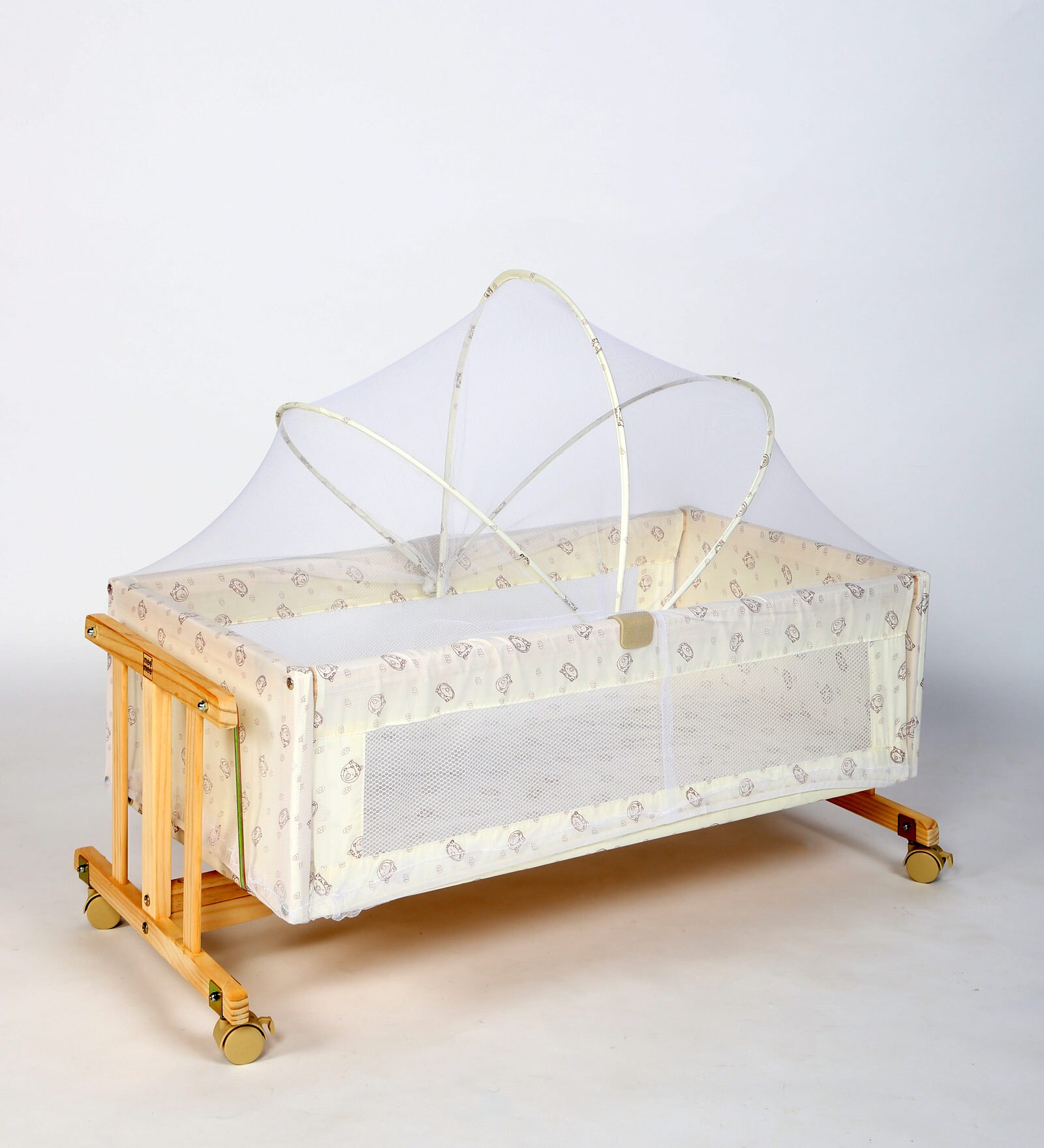 wooden cot with mosquito net